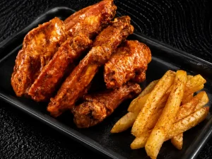 10 crispy chicken wings combo served with hand-cut chips or pap available in various Mama's Wings flavours