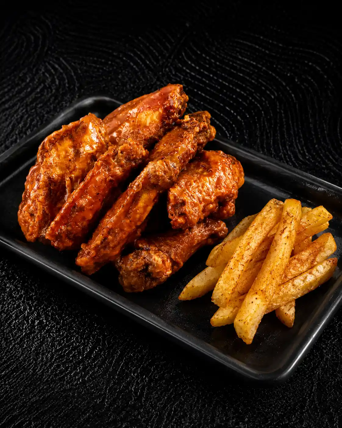 10 crispy chicken wings combo served with hand-cut chips or pap available in various Mama's Wings flavours