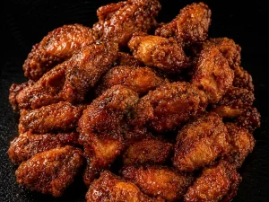 30 chicken crispy wings from Mama's Wings served with various available flavours